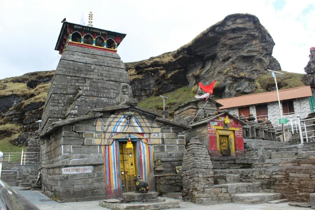 Historic Madhyamaheshwar Temple amidst Himalayan mountain landscape