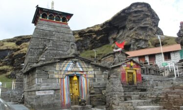 Historic Madhyamaheshwar Temple amidst Himalayan mountain landscape