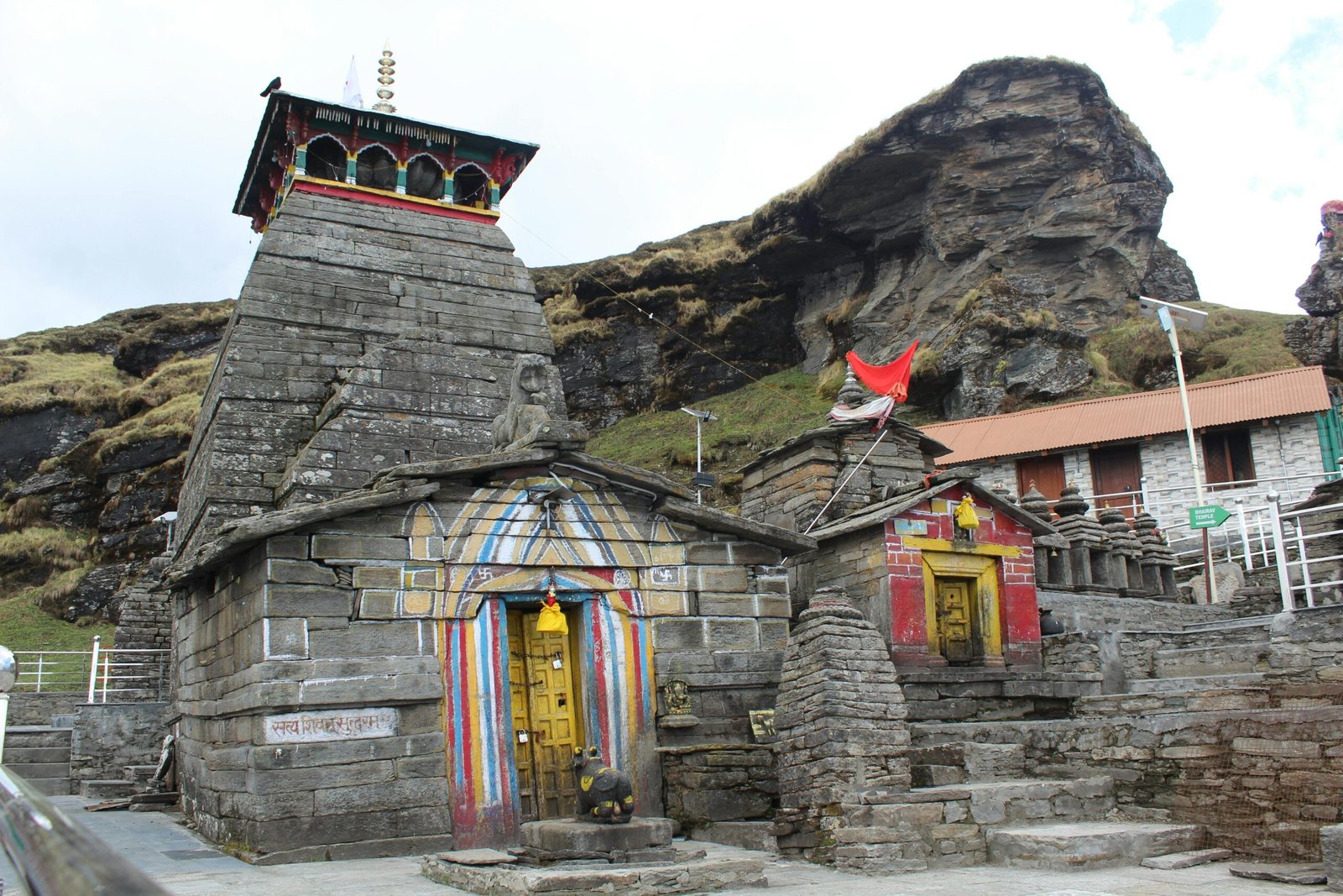 Historic Madhyamaheshwar Temple amidst Himalayan mountain landscape