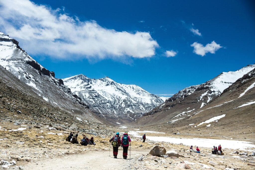 Trekkers exploring snowy Yulla Kanda mountain trail