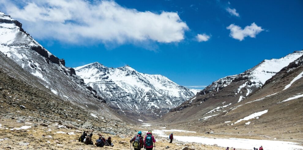 Trekkers exploring snowy Yulla Kanda mountain trail