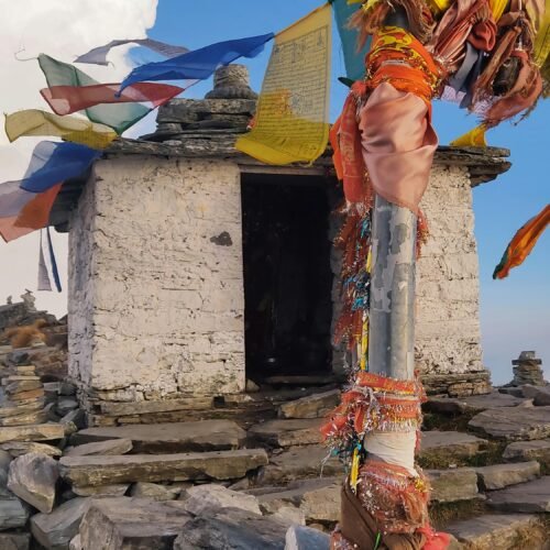 Mountain shrine with colorful prayer flags
